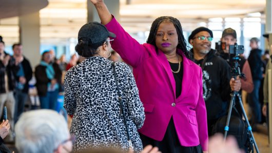 A woman who led a protest that disrupted a Minnesota church service has been arrested