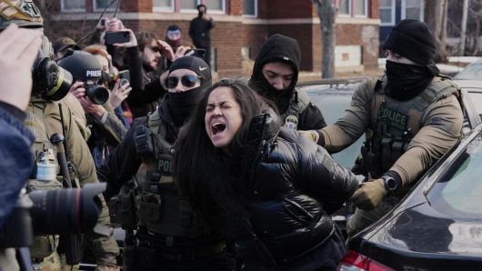 Federal immigration agents filmed dragging a woman from her car in Minneapolis