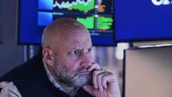 Stocks zigzag on Wall Street following mixed profit reports from UnitedHealth, GM and others