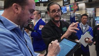Wall Street drifts in mixed trading as Intel tumbles