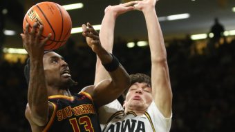 Kam Woods, USC men edged by Iowa