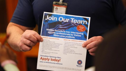 US applications for jobless aid fall to 206,000 last week as layoffs remain low