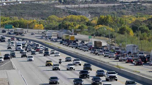 Could more speed limit signs on 15 Freeway through Cajon Pass improve traffic flow?